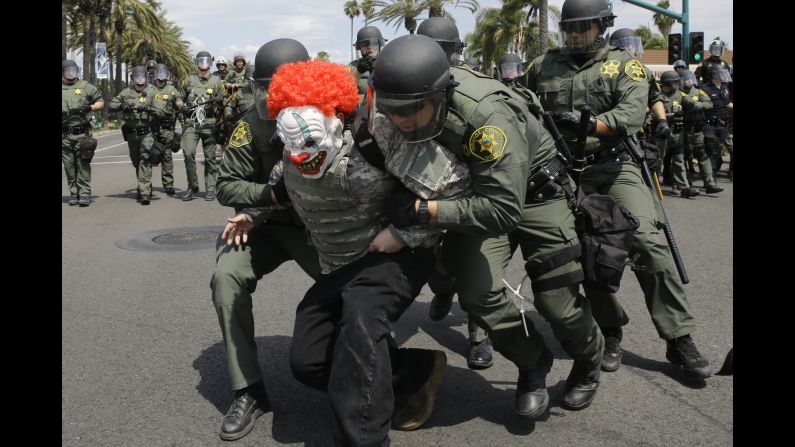 Sheriff's deputies arrest a protester near the convention center in Anaheim, California, on Wednesday, May 25. Republican presidential candidate Donald Trump was holding a rally at the convention center.