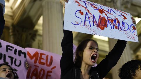 Brazilians protest in front of the Legislative Assembly of Rio de Janeiro on May 27, 2016, against a gang-rape of a 16-year-old girl.