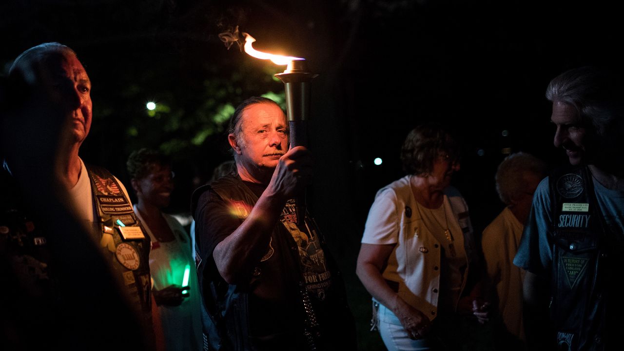 Joe Bean, vice president of Rolling Thunder, carries a torch near the Vietnam Veterans Memorial in Washington on May 27.