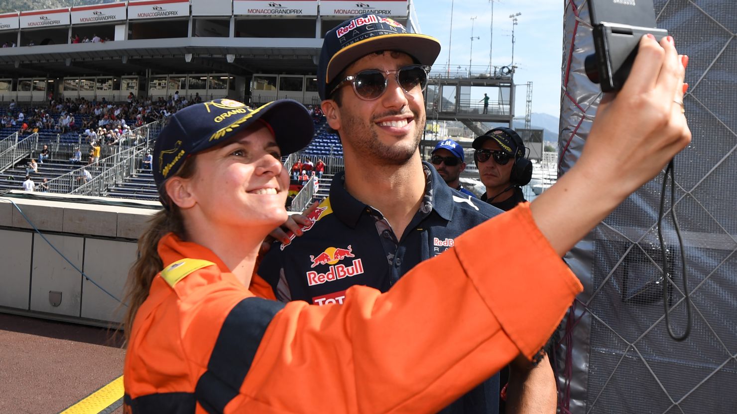 Ricciardo stops to pose for a selfie with steward after claiming pole position in Monaco.