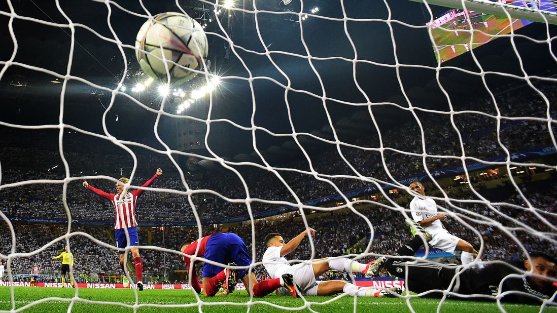 The ball hits the net as Atletico Madrid forward Yannick Carrasco scores the first goal during the UEFA Champions League final football match.