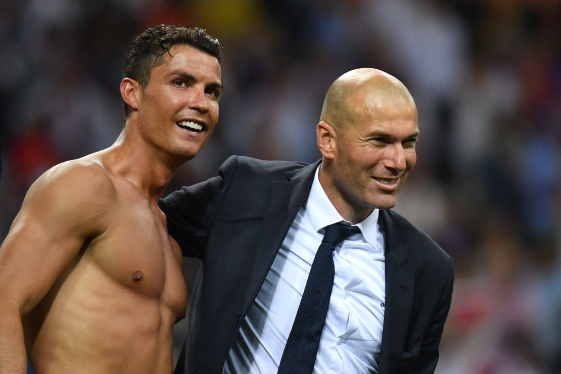 Real coach Zinedine Zidane celebrates with Ronaldo after sealing victory.