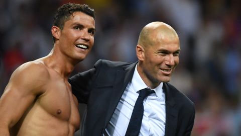 Real coach Zinedine Zidane celebrates with Ronaldo after sealing victory.