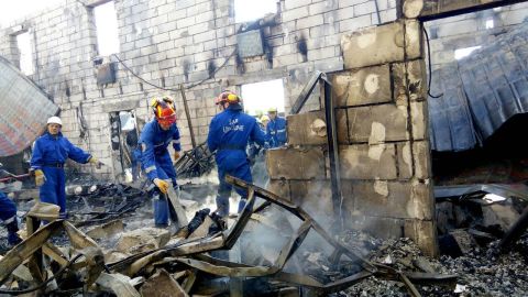 Emergency workers at the scene of the blaze.