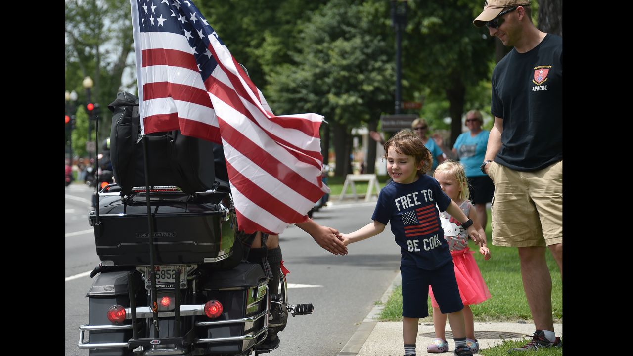 A child greets motorcyclists during Rolling Thunder's annual "Ride for Freedom" parade in Washington on Sunday, May 29. The biker rally is a tradition on Memorial Day weekend, paying tribute to prisoners of war and Americans missing in action.