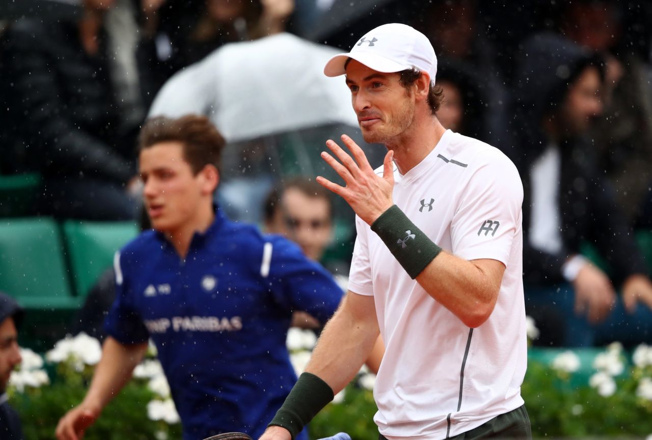 Much of the tournament has been blighted by weather this year. Andy Murray walked off court as rain stopped play during his May 29 fourth-round match against John Isner of the United States.