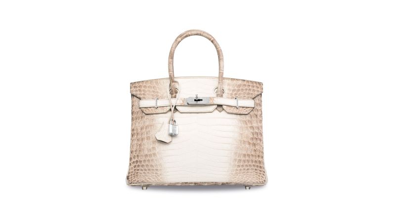 This Hermes signature Birkin is made with white matte Himalayan crocodile leather, and features hardware made from 18k white gold and diamonds. It sold for $300,168, making it the most expensive handbag ever sold. 