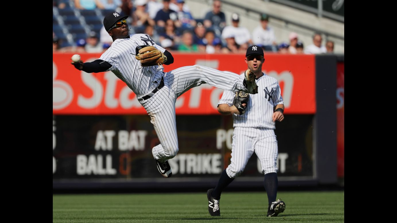 Didi Gregorius, shortstop for the New York Yankees, makes a leaping throw during a game against Toronto on Thursday, May 26.