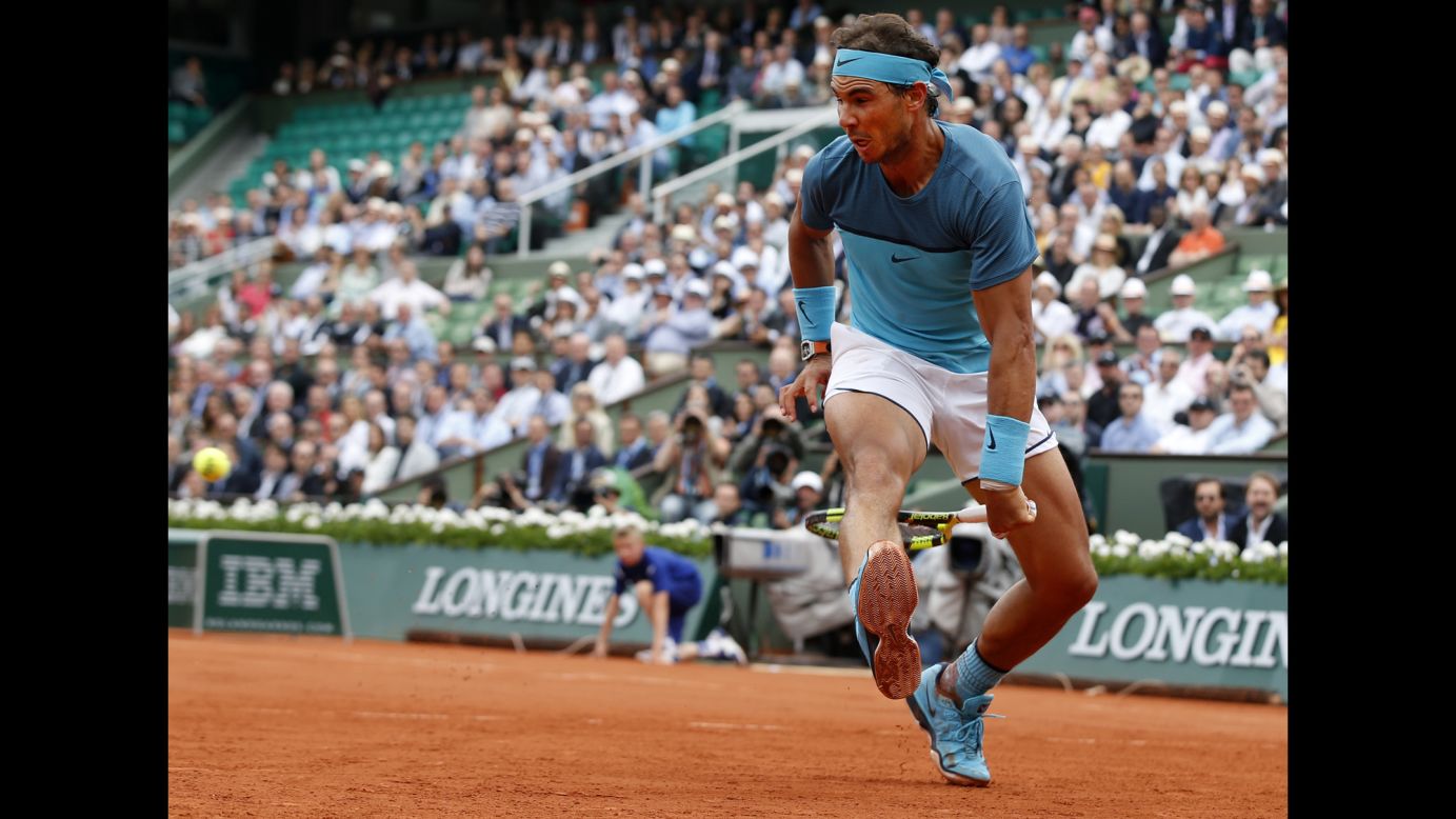 Rafael Nadal hits a shot between his legs during a second-round match at the French Open on Thursday, May 26. By beating Facundo Bagnis, Nadal became the eighth man in history <a href="http://www.cnn.com/2016/05/26/tennis/french-open-rafael-nadal-novak-djokovic-tennis/" target="_blank">to record 200 wins at Grand Slams.</a> But a wrist injury forced him to withdraw from the tournament the next day.