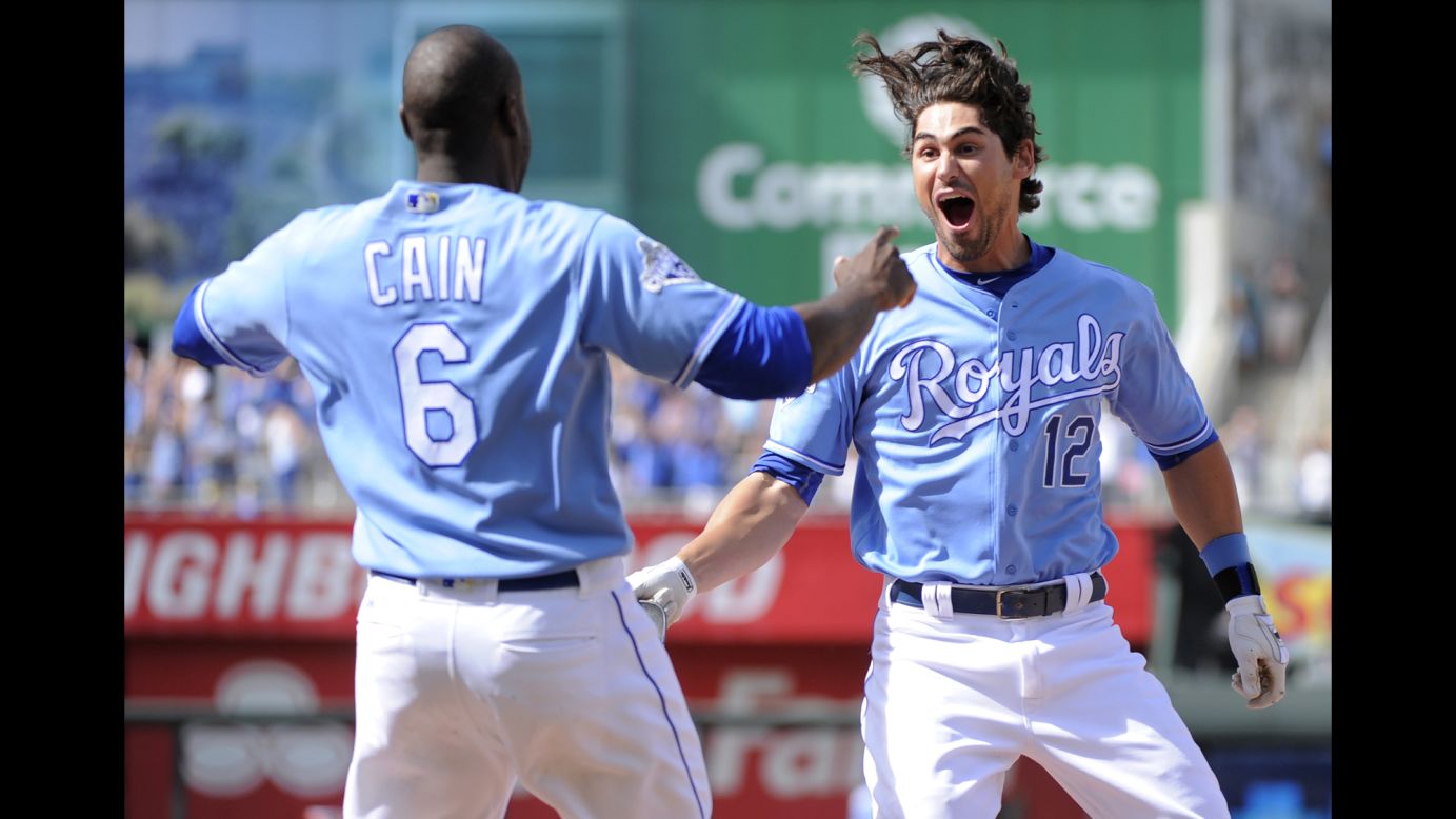 Lorenzo Cain and Brett Eibner celebrate after Eibner hit a game-winning RBI for the Kansas City Royals on Saturday, May 28.
