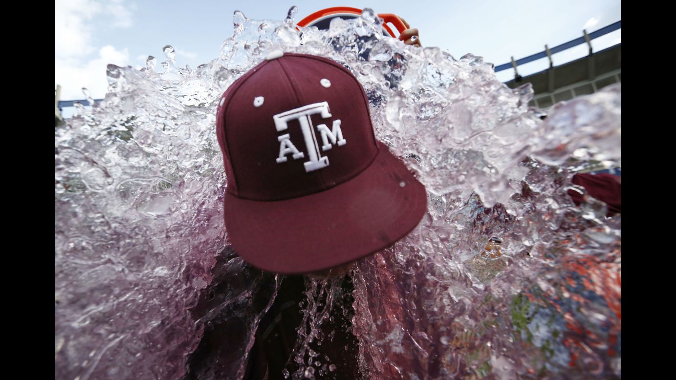 Texas A&M head coach Rob Childress is doused by his players after they won the SEC baseball tournament on Sunday, May 29.