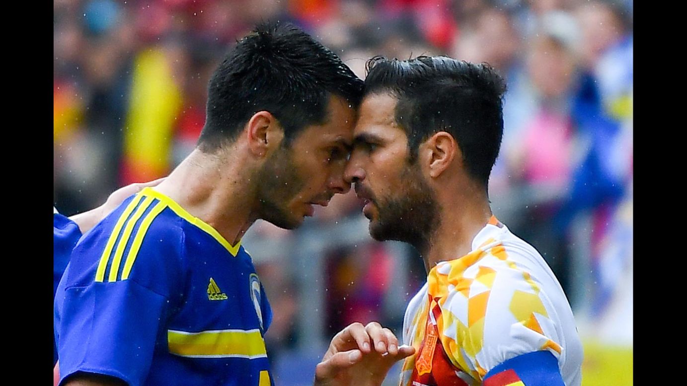 Emir Spahic, a soccer player with Bosnia-Herzegovina, argues with Spain's Cesc Fabregas, right, during an international friendly match on Sunday, May 29. 
