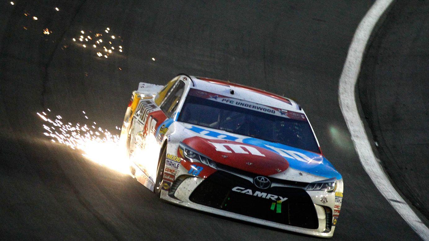 Sparks fly from the car of Sprint Cup driver Kyle Busch during the Coca-Cola 600 on Sunday, May 29.