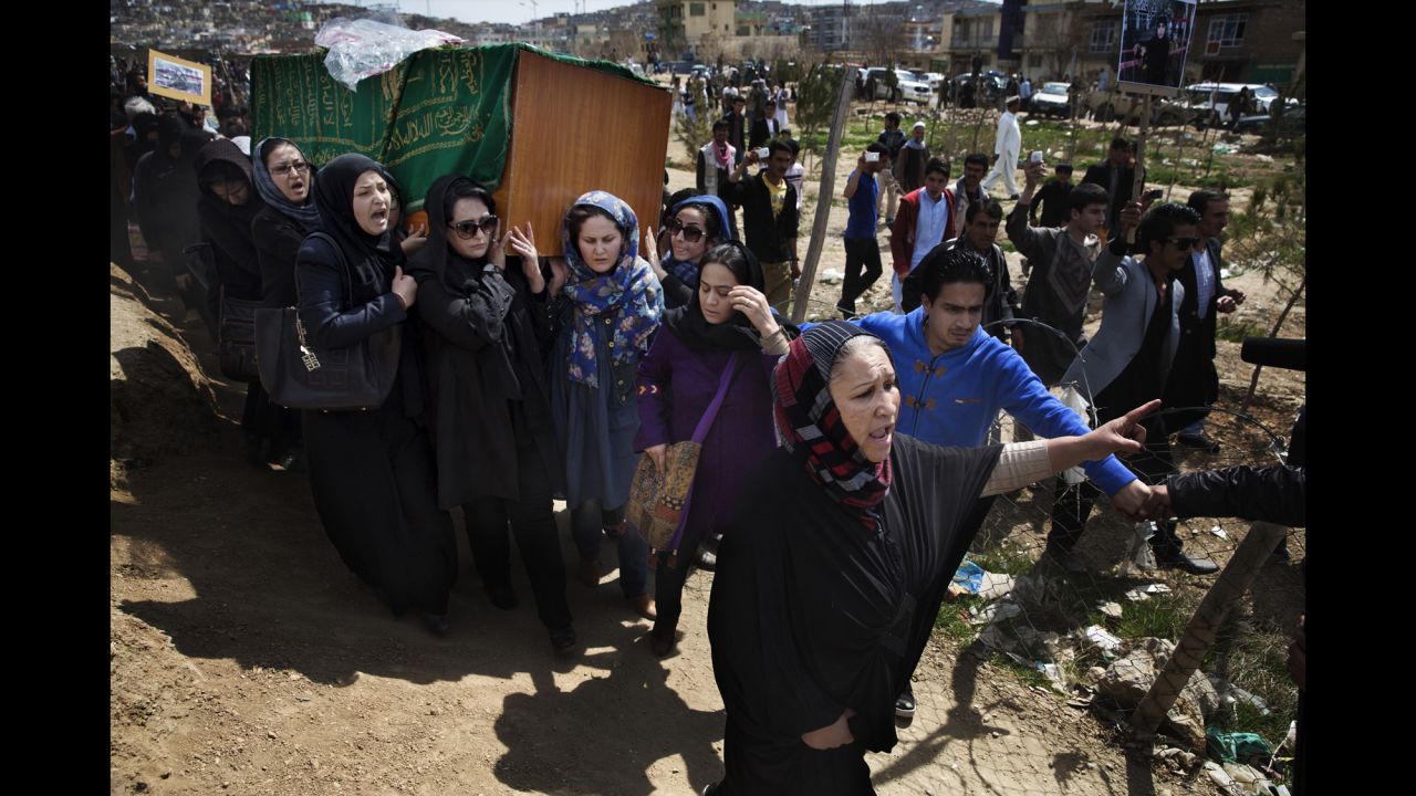 The casket of Farkhunda Malikzada is carried by relatives, friends and women's rights activists in March 2015. Malikzada was killed by a mob in the center of Kabul, Afghanistan, after being falsely accused of desecrating a Quran.