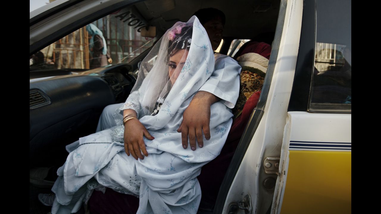 Zahara, 24, is held by her fiance, Gulam Ali, as they leave for a wedding ceremony in Bamiyan, Afghanistan, in October 2010.