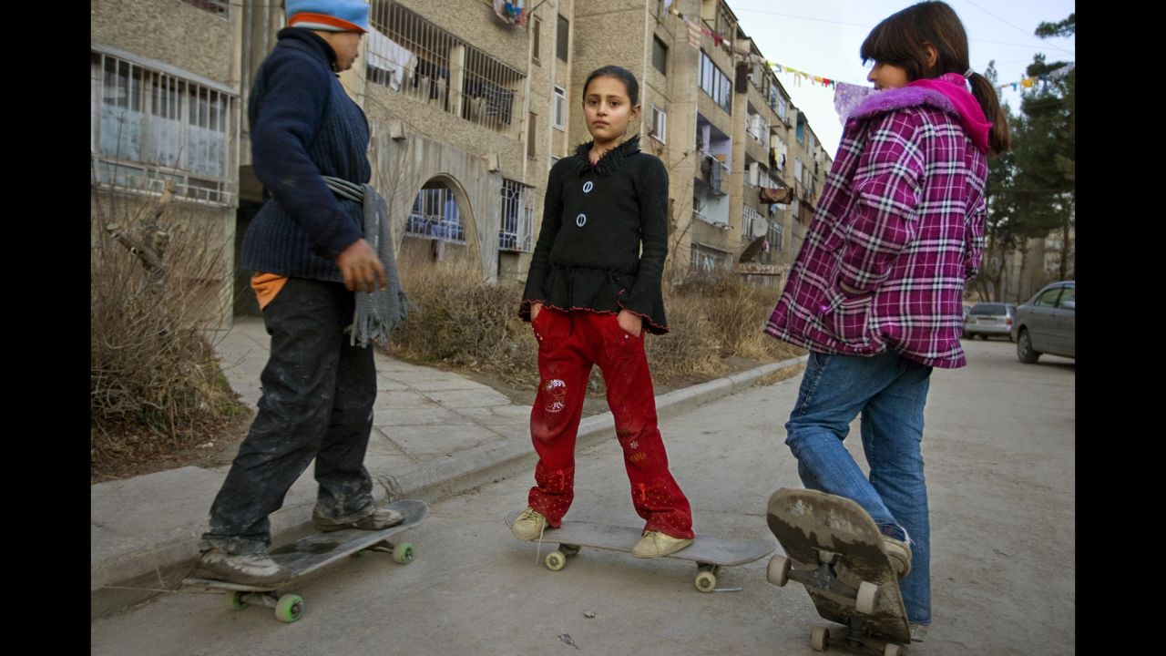 Children skateboard around a middle-class neighborhood in Kabul in January 2009.