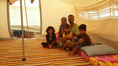 Mohammed, his wife and three children in the displacement camp of Amiriyat Al Fallujah