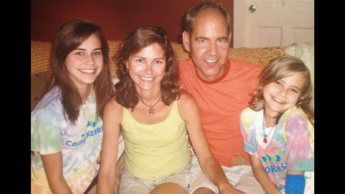 Abi Yates, left, with her mother, father and younger sister, Sophie. 