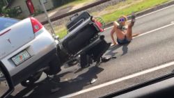The Florida Highway Patrol is investigating a wild hit-and-run caught on video in Tampa.    Cell phone video shows what appears to be a driver of a silver car deliberately plow down two people on a motorcycle.    The incident happened on US 41 and County Line Road around 5:35 p.m. on Monday.    According to witness, Abe Garcia, who captured the incident on video, the driver of the motorcycle confronted the driver of the car after he witnessed the car cut the motorcyclist off.    "The guy driving the car was driving recklessly, like crazy out of control," Garcia said.  "I saw him almost run one of the bikers over, like off the side of the road.  So, then the bikers caught up to him at a red light and words started exchanging, and then the guy went complete psychopath."    That's when Garcia said the driver, who has not been identified, deliberately tried to run the man and woman over.    "The guy tried to kill them," Garcia said.  "It was a red light and then it turned green.  He could've just gone straight  but he went for the biker."    Action News has reached out to the Florida Highway Patrol and is awaiting an official report.    Garcia said the driver was arrested down the road about five minutes later by FHP.
