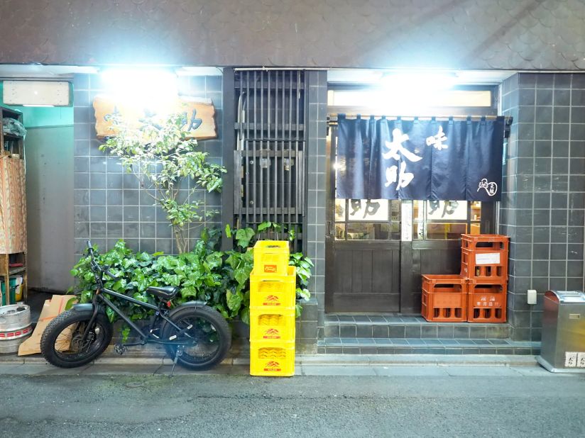 Aji Tasuke's exterior. The small eatery sits on a busy, restaurant-filled Sendai street.  