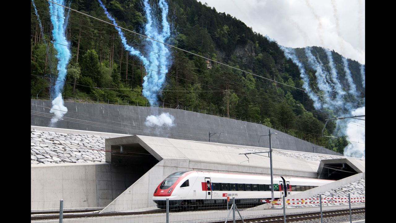The first train comes out of the tunnel in Erstfeld.
