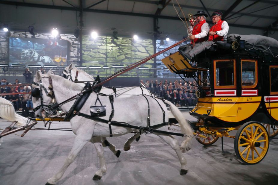 A horse-drawn carriage parades during the opening of the tunnel.