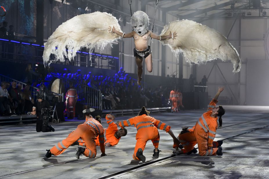 Artists perform during the grand opening for the tunnel, the world's longest and deepest rail tunnel.