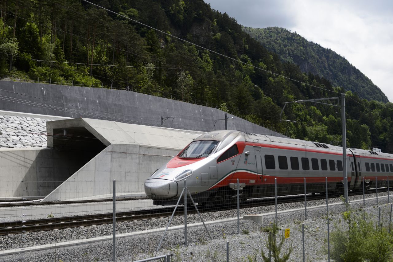 Regular rail service began in December 2016 through Switzerland's Gotthard Base Tunnel, the world's longest and deepest tunnel. It runs beneath the Swiss Alps. Pictured: An Italian train at the tunnel's northern entrance on the eve of the tunnel's June opening ceremony. <strong>Length: </strong>57 kilometers.