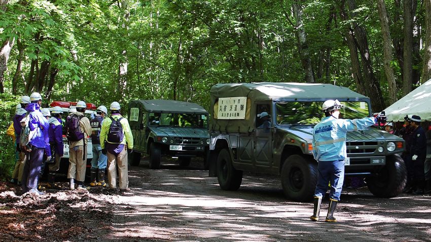 Self-Defense Forces vehicles are heading to search for a missing boy in Nanae on Japan's main northern island of Hokkaido, on June 1, 2016. 
Japan's military on June 1 joined the difficult search for a seven-year-old boy missing since his parents abandoned him in a bear-inhabited forest, officials said. / AFP / JIJI PRESS / JIJI PRESS / Japan OUT        (Photo credit should read JIJI PRESS/AFP/Getty Images)