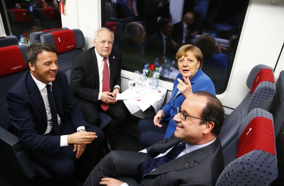 From left to right, Italian PM Matteo Renzi, Swiss President Johann Schneider-Ammann, Germany Chancellor Angela Merkel and French President Francois Hollande on board the maiden voyage on the line.
