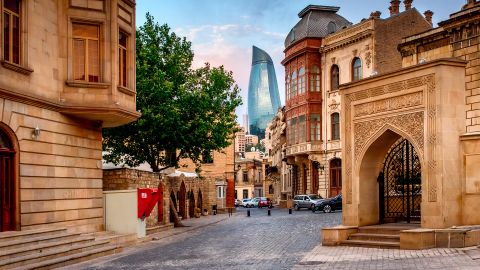 Baku prides itself on being a city that combines the historic and modern. Here, one of the city's famous Flame Towers peeps between the walls of the old city.