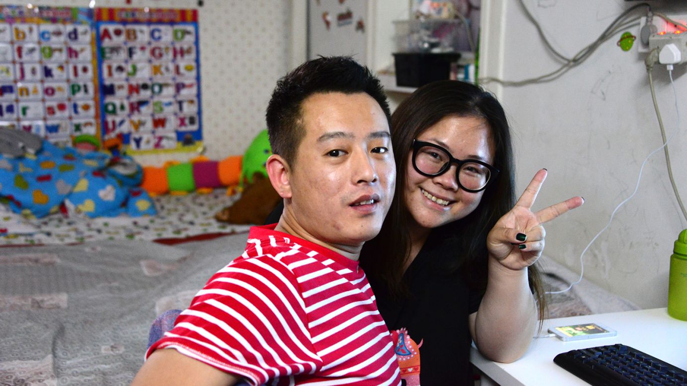 Xu Yang (left) and Xiao Xiaoxiao have lived here for years. Their home is a handed-down 20-square-meter room near the entrance of the former stock exchange building.