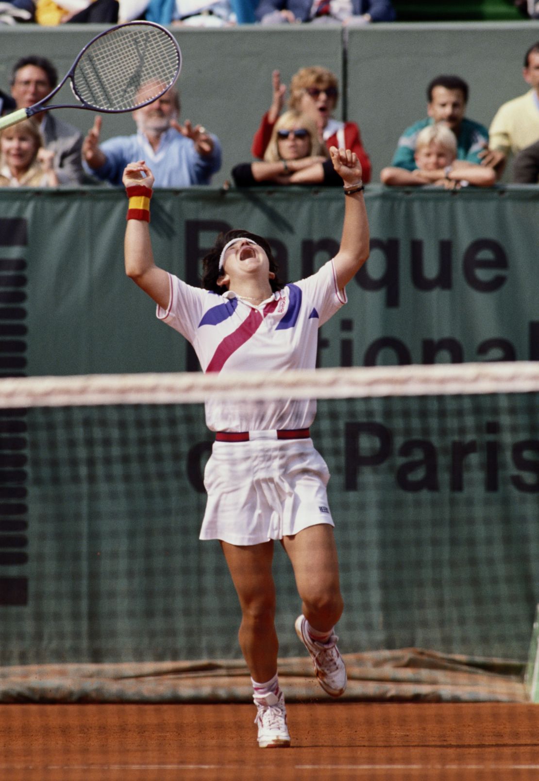 Sanchez Vicario throws her racquet into the air after winning  the Women's French Open  in 1989.