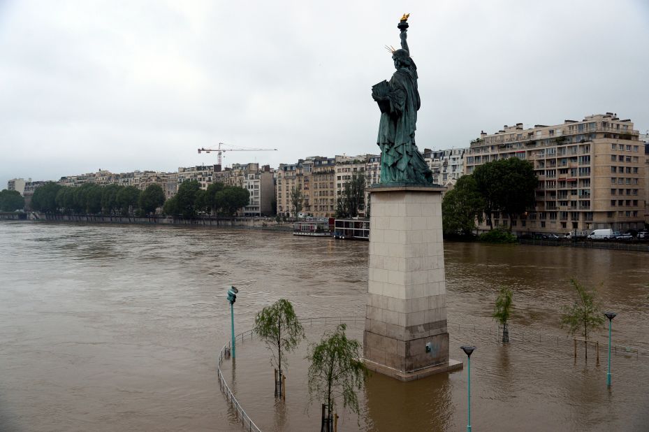 A replica of the Statue of Liberty faces the overflowing Seine in Paris on Wednesday, June 1.