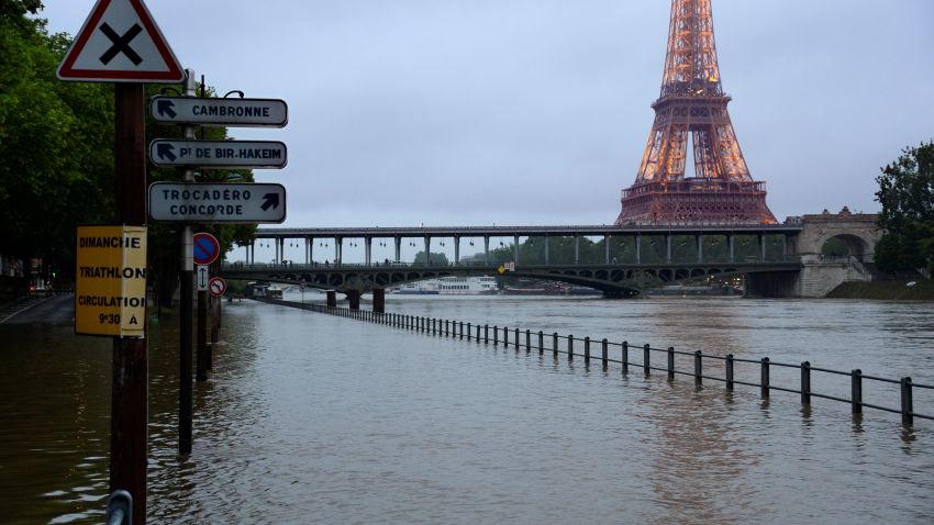 The Eiffel Tower looms over a flooded Seine river in Paris, June 1, 2016. Four bodies were found floating in homes in France and Germany after flash floods caused by heavy rains trapped people in their homes.