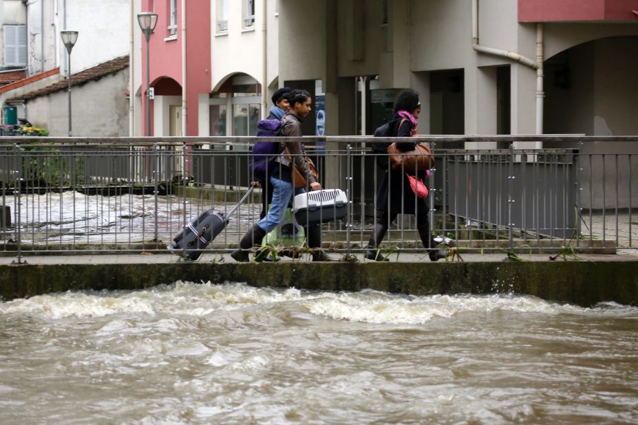 People leave their home in Longjumeau on June 2. 