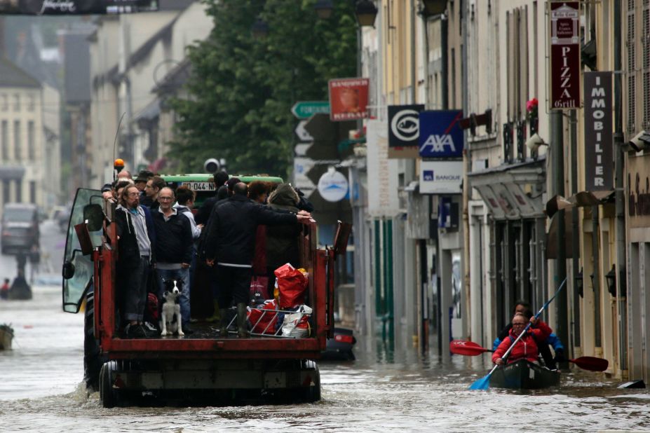 Residents are evacuated from their homes in Nemours on June 2. Water from the Loing River flooded the streets of the French town.