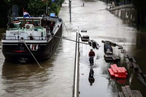A man rides a bike through a Paris street flooded by the Seine on June 2. 