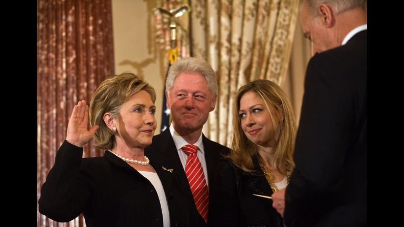 Hillary Clinton is ceremonially sworn in as secretary of state by Vice President Joe Biden, as her husband, former President Bill Clinton, and daughter Chelsea look on at the State Department in Washington on February 2, 2009.