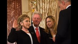 US Secretary of State Hillary Clinton is ceremonially sworn in by Vice President Joe Biden as her husband former president Bill Clinton and daughter Chelsea look on at the State Department in Washington on February 2, 2009.
