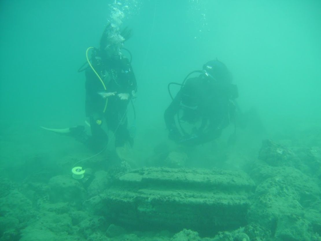 Divers investigate the natural geological phenomenon on the shores of the Greek island Zakynthos.