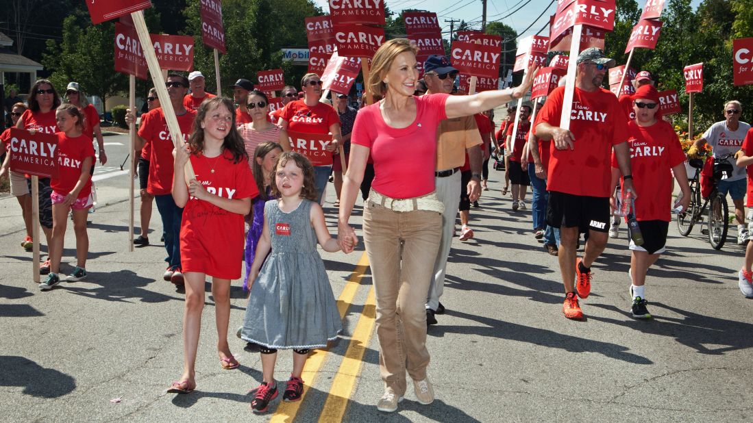 Former Hewlett-Packard CEO Carly Fiorina marches with her family in the Labor Day parade in 2015 in Milford, New Hampshire. Fiorina unsuccessfully sought the GOP presidential nomination in 2016 and then briefly joined Sen. Ted Cruz as his running mate before he suspended his campaign.