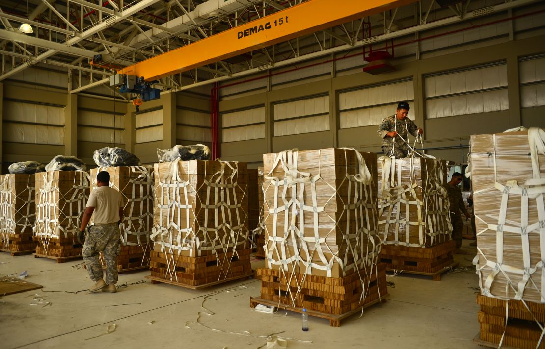 The U.S. Army prepares packages of meals for a 2014 airdrop in southwest Asia. 