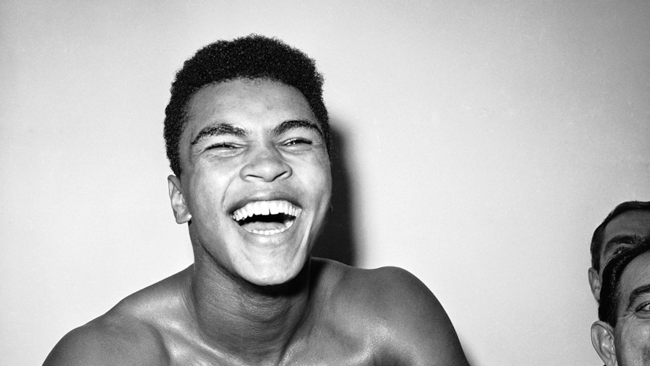 Cassius Clay is a happy young man in his dressing room after knocking out Archie Moore in the exact round he predicted he would, the fourth, at Los Angeles, Nov. 17, 1962.  (AP Photo)