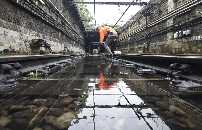 A technician assesses flood damage on railway  tracks in Paris on Saturday, June 4. <a href="index.php?page=&url=http%3A%2F%2Fwww.cnn.com%2F2016%2F06%2F04%2Feurope%2Ffrance-germany-floods%2Findex.html" target="_blank">The rain-swollen Seine river receded Saturday for the first time in a week after nearing its highest level in three decades. </a>