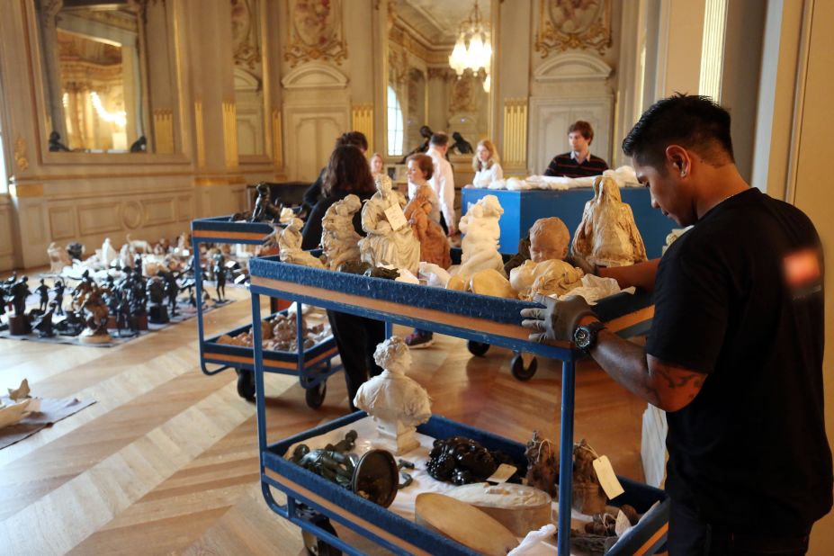 An employee of the Musée d'Orsay moves artwork to protect it from the flooded Seine river on June 3.