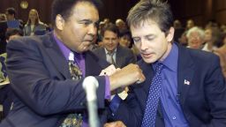 Muhammad Ali and Michael J. Fox talk before the start of a Senate subcommittee on Labor, Health, Human Services and Education hearing on Parkinson's Disease in May 2002 in Washington, DC. 