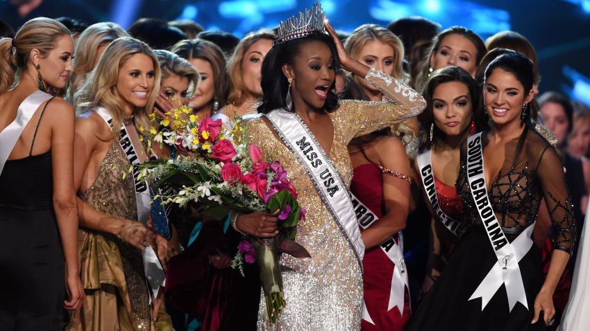 LAS VEGAS, NV - JUNE 05:  Miss District of Columbia USA 2016 Deshauna Barber (C) is surrounded by fellow contestants after she was crowned Miss USA 2016 during the 2016 Miss USA pageant at T-Mobile Arena on June 5, 2016 in Las Vegas, Nevada.  (Photo by Ethan Miller/Getty Images)