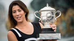 Spain's Garbine Muguruza poses for photographers with her trophy one day after winning her women's final match against US player Serena Williams at the Roland Garros 2016 French Tennis Open on June 5, 2016 at Place de la Concorde in Paris. AFP PHOTO / MARTIN BUREAU / AFP / MARTIN BUREAU        (Photo credit should read MARTIN BUREAU/AFP/Getty Images)