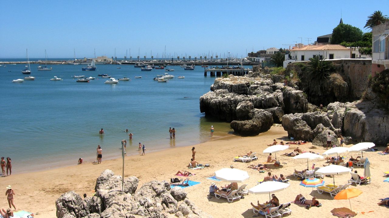 Vast stretches of sand and turquoise waters can be found east of the Portuguese capital.